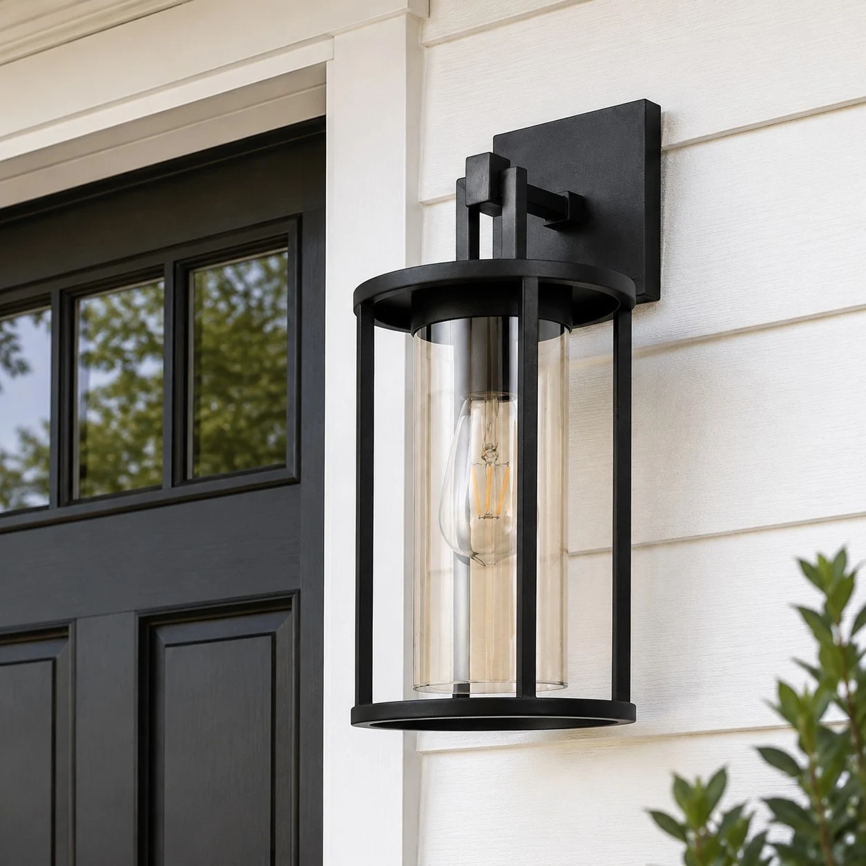 Installed black outdoor wall lantern beside an exterior door